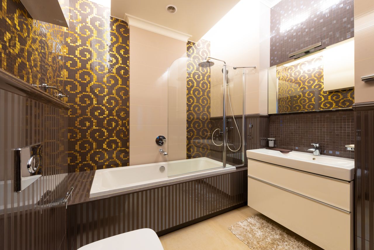 Contemporary bathroom featuring a luxurious design with modern fixtures and patterned tiles.